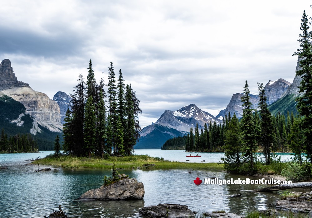 Red Canoe arrives at Maligne Lake's Spirit Island