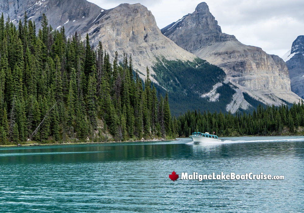 Boat Cruise Passing Mountain Range