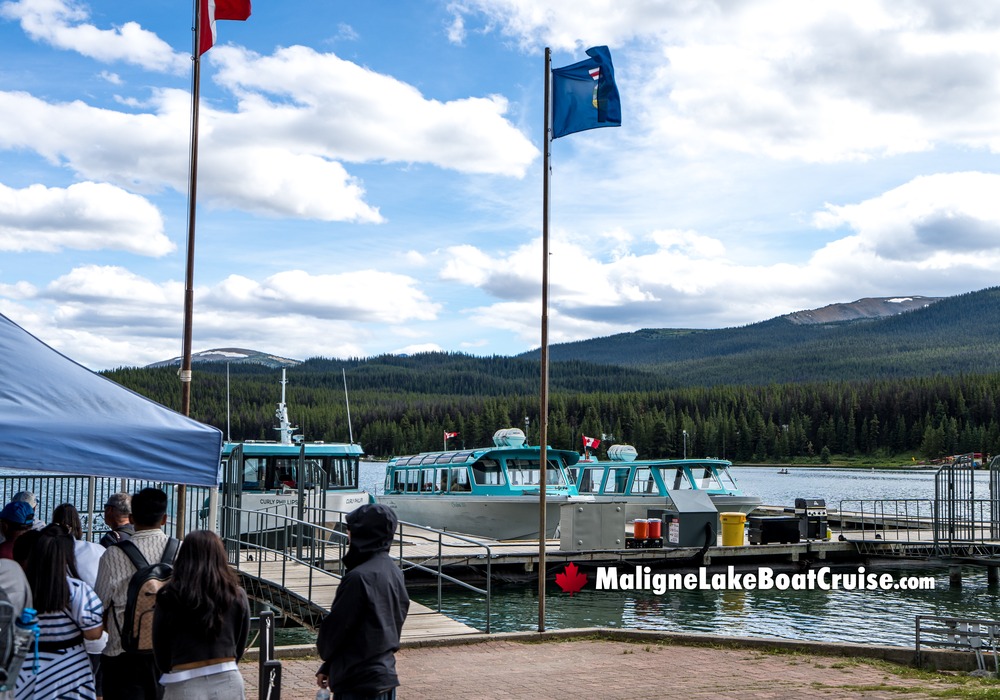 Maligne Lake Boat Cruise Visitors with Flags Waving
